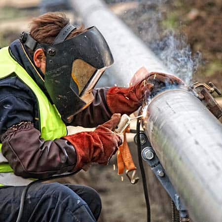 An image of a well-qualified welder welding a pipe. WPS - Welding Procedure Specifications PQR - Procedure Qualification Records, and WQT / WPQ – Welder Qualification Test / Welder Performance Qualifications.