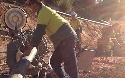 welding supervisor inspecting poly pipe in the field