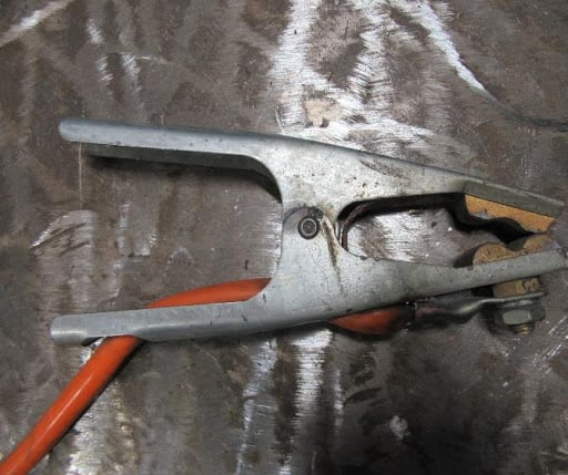 Spring clamp type work return lead