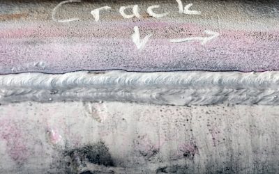 What is fatigue failure in metals, and what factors reduce the fatigue life of welded components?